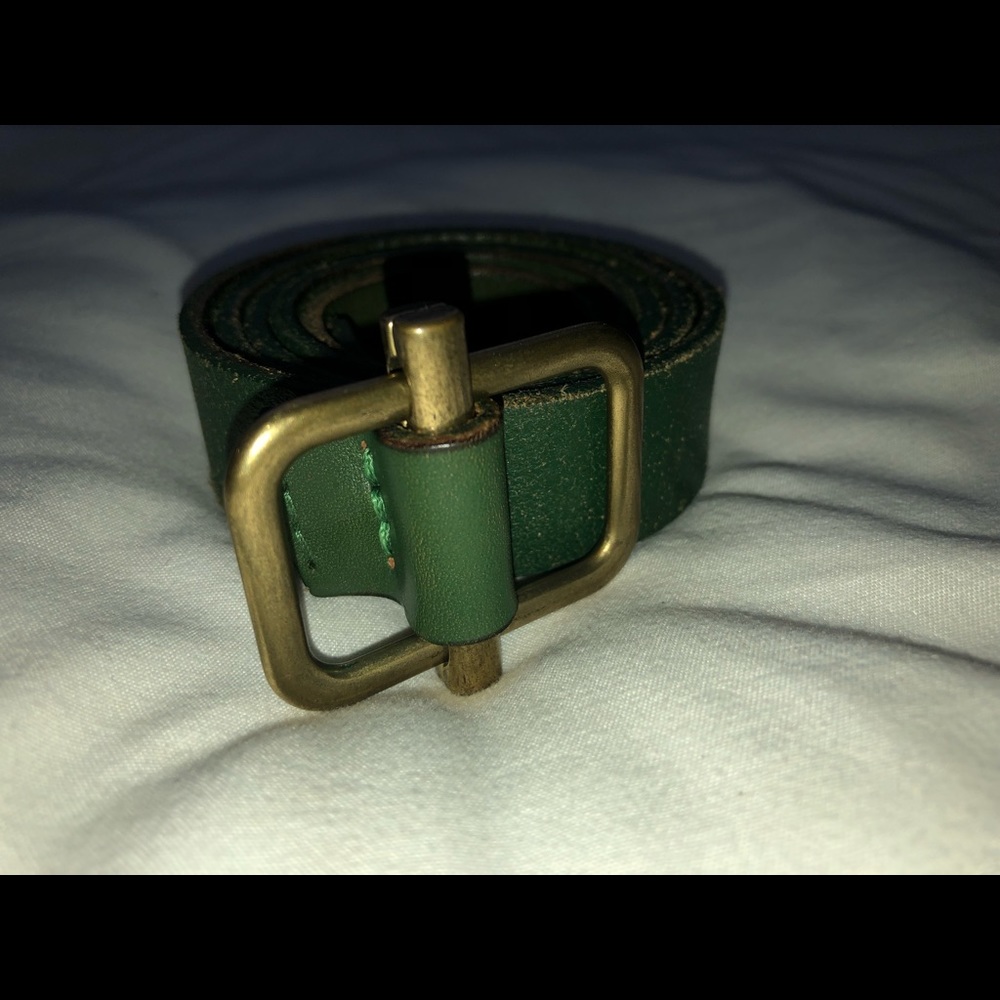 Green belt with gold buckle